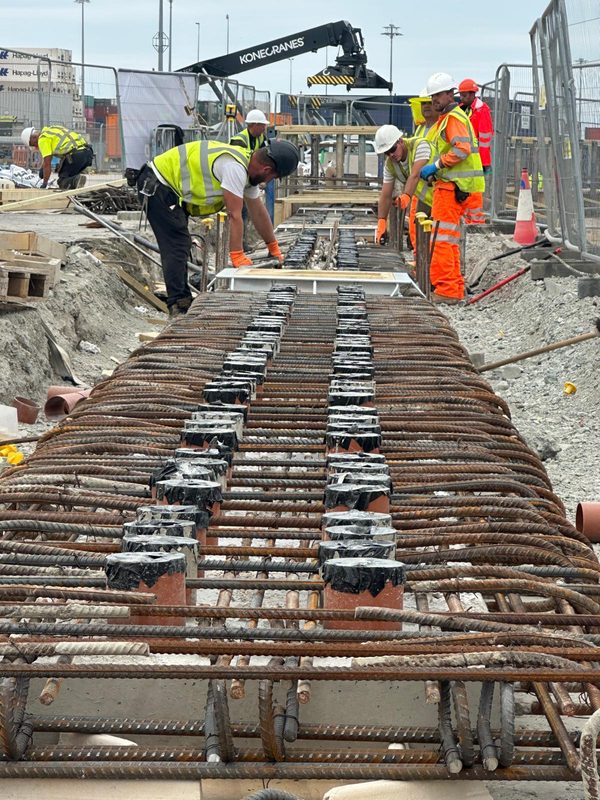 Workers preparing rebar for concrete pour